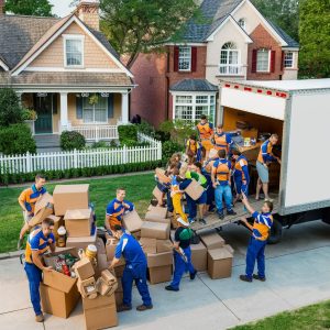 Movers carefully packing household items

